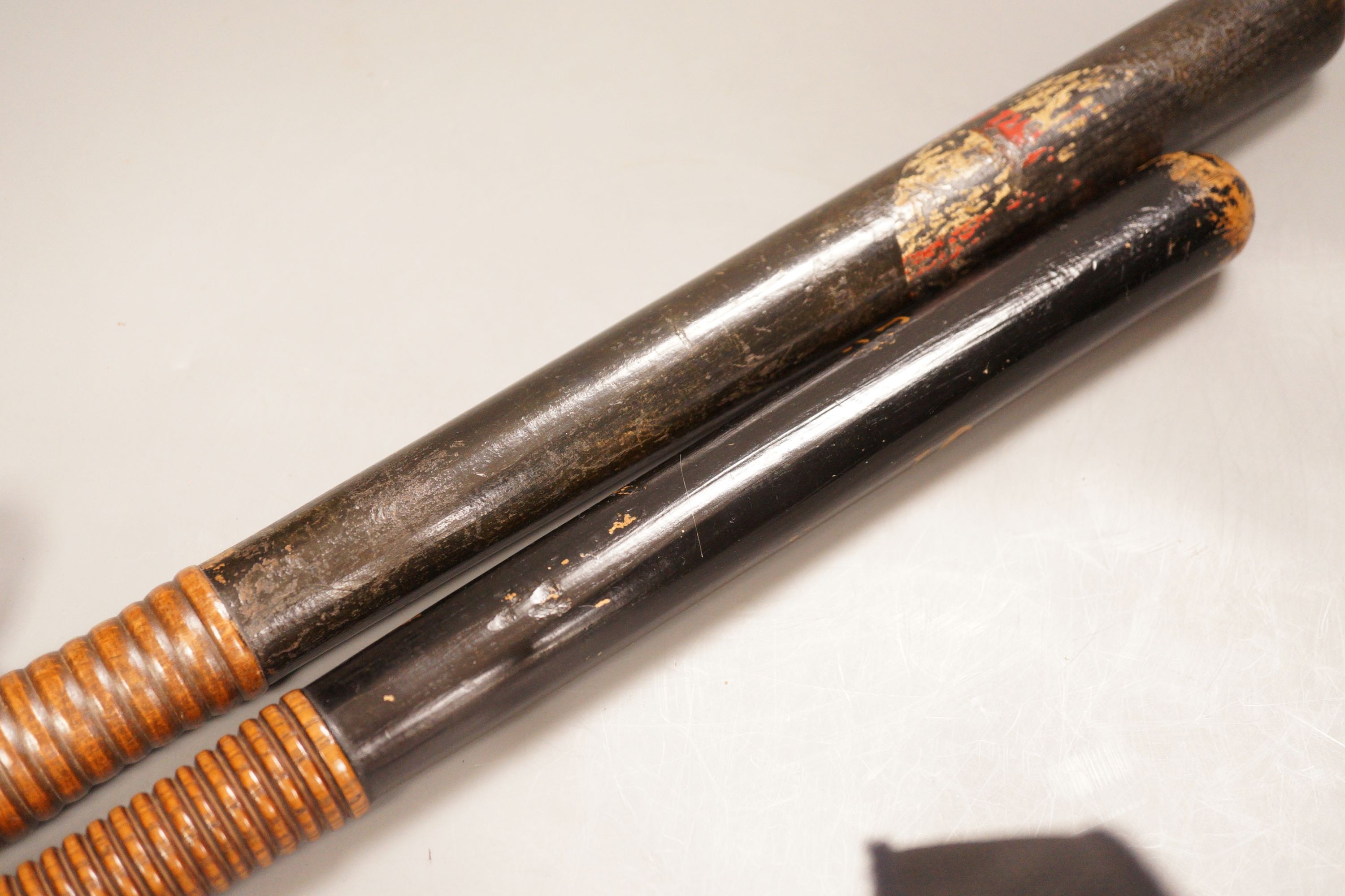 Two Victorian painted truncheons, one ‘Sergt. 21 E.S.C’, the other painted with St. George’s cross, 47cm
